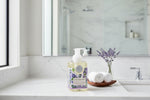 Foaming hand soap bottle with lavender design on a white background