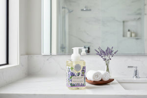 Foaming hand soap bottle with lavender design on a white background