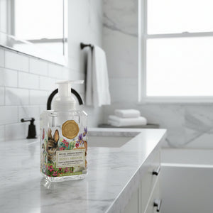 Foaming hand soap bottle with rabbit and flower design on a white background