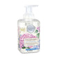 A pump bottle of Michel Design Works Wild Hydrangea Foaming Shea Butter Hand Soap with floral patterns on the label.