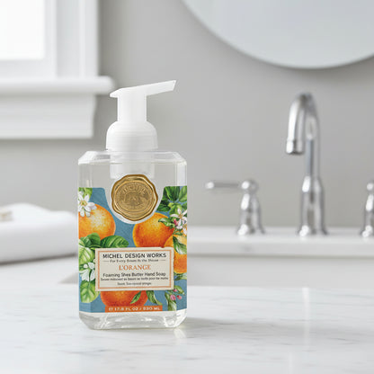 Foaming Shea Butter Hand Soap bottle with orange design on a white background