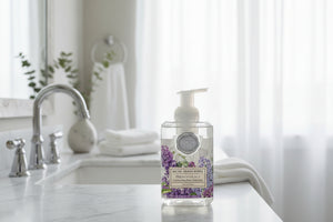 Foaming hand soap bottle with French Lilacs design on a white background
