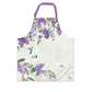 A white apron with pockets, featuring a floral pattern with purple lilacs and green leaves, and a hummingbird illustration.