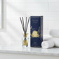 Côte Noire diffuser with clear bottle and gold accents on a white background