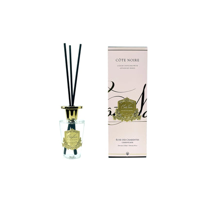 Côte Noire diffuser with reeds and packaging on a white background