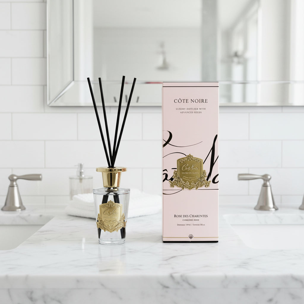Côte Noire diffuser with reeds and packaging on a white background