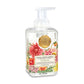 A pump bottle of Michel Design Works Dahlias Foaming Shea Butter Hand Soap with floral designs and a gold-colored logo.