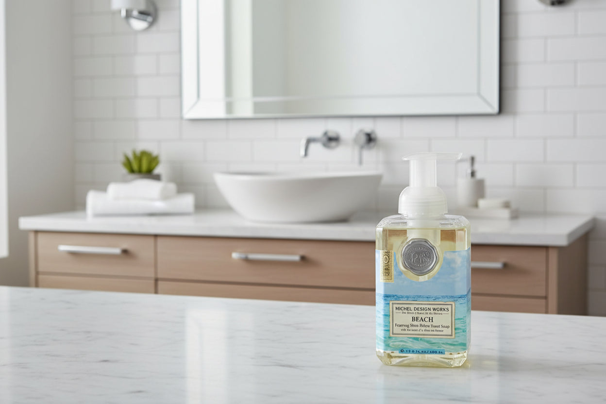 Foaming hand soap bottle with beach-themed design on a white background