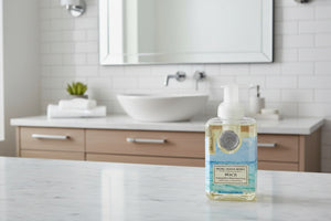 Foaming hand soap bottle with beach-themed design on a white background